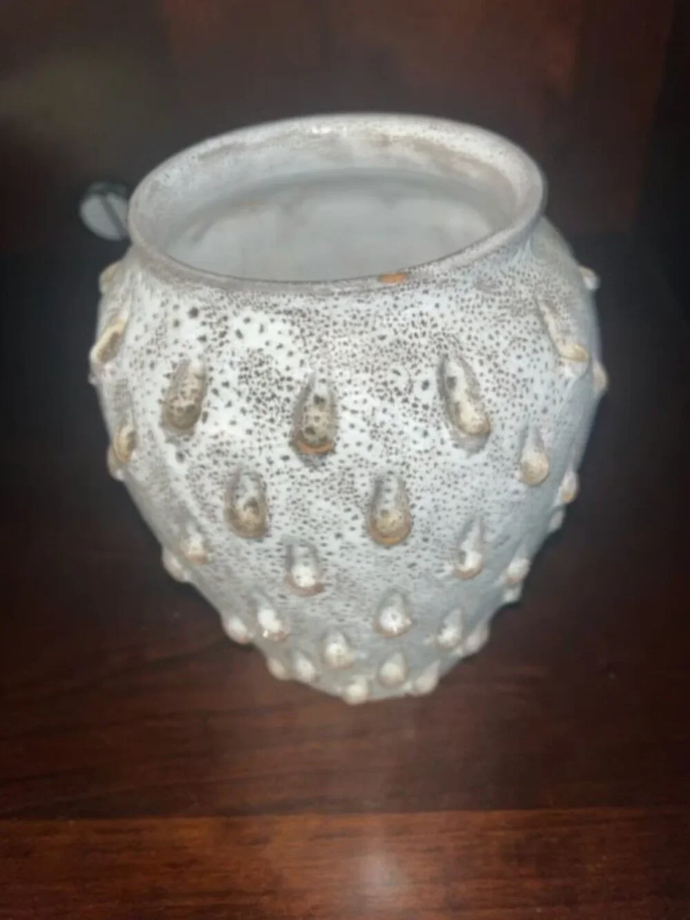 Ceramic vase with white speckled teardrop-shaped patterns